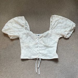Very cute, feminine, trendy crop top w/ lace up front and puff shoulder sleeves